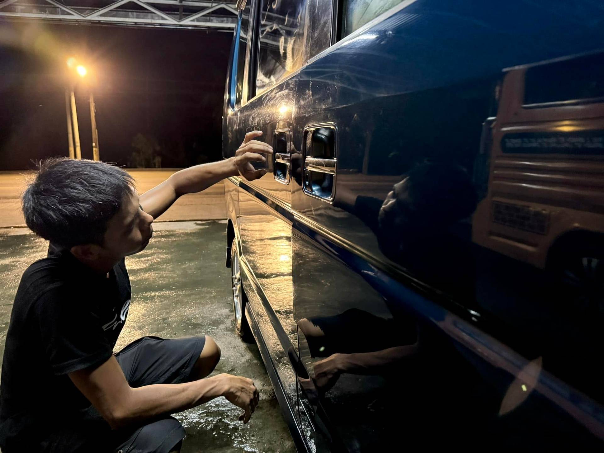 Detailer polishing a van at El Primo Carwash
